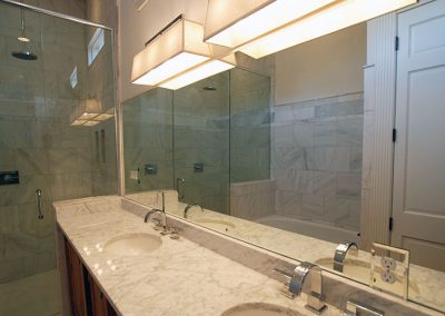 Mirror and shower glass installation.